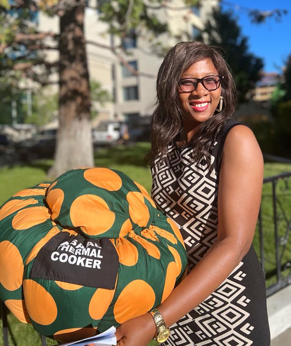 Aisata Ibamie holds her ASAAB Thermal Cooker